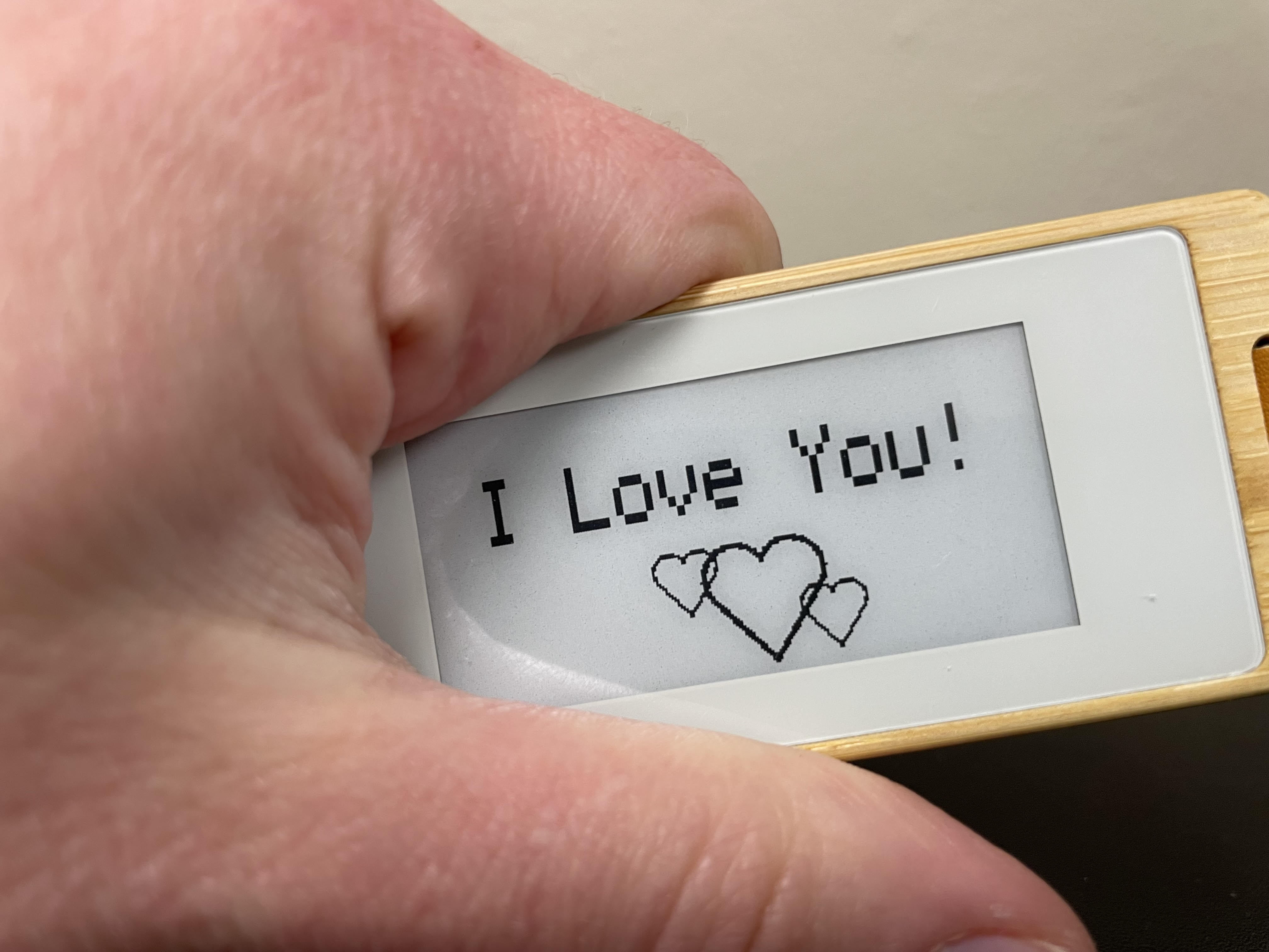 A KEEP held in one hand, testing a screen colour.