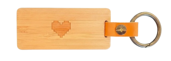 Back of the KEEP keychain — bamboo body engraved with a pixel heart.